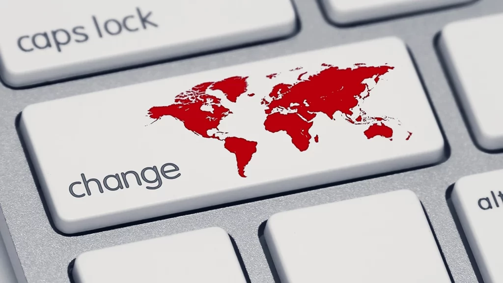 close up photo of a computer keyboard where the shift key has been changed to a key with a world map and the word "change". Representing the shift in the marketplace towards ethical, do-good businesses that want to make a difference in the world.